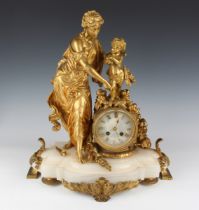 A late 19th century French ormolu and onyx mantel clock with eight day movement striking on a