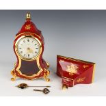 A 20th century Zenith red and gilt lacquered bracket clock and bracket, the clock striking on a