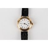 An 18ct gold circular cased lady's wristwatch with unsigned jewelled movement, the enamelled dial