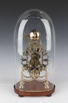 A Victorian brass skeleton clock with eight day single fusee movement striking hours on a bell,