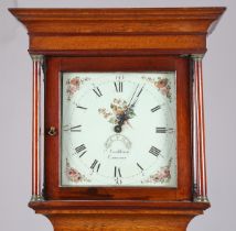 A late George III oak and crossbanded mahogany longcase clock with thirty hour movement striking