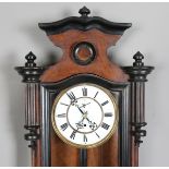 A late 19th century walnut and ebonized Vienna style wall timepiece with single train movement,