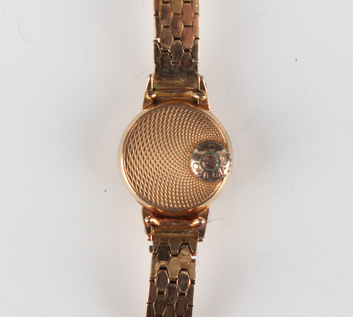 An Omega 18ct gold lady's rear-winding bracelet wristwatch, the signed silvered circular dial with - Image 4 of 4