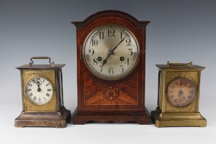 An early 20th century inlaid oak mantel clock with eight day movement striking on a gong, height