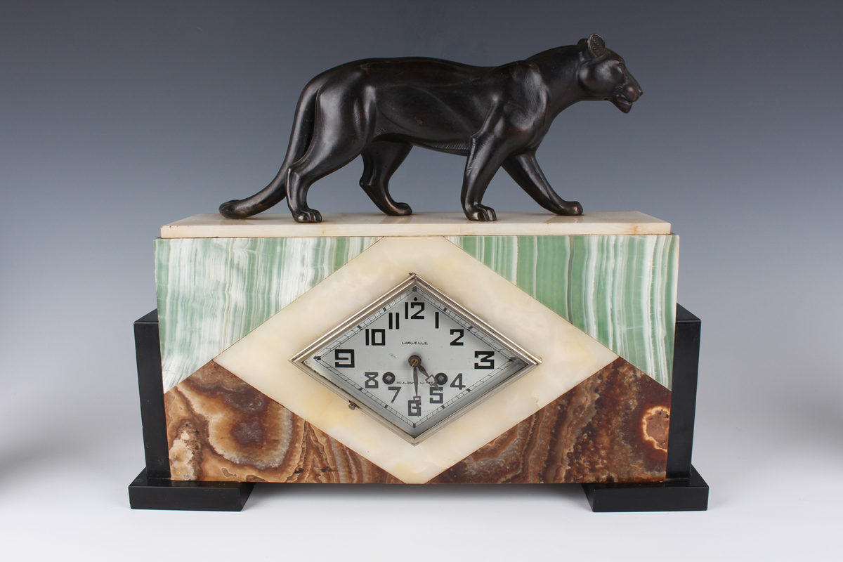 An Art Deco French varicoloured onyx, slate and spelter mantel clock garniture, the clock with eight - Image 12 of 12