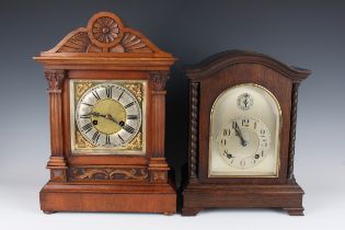 A late 19th century German walnut mantel clock with eight day movement striking on a gong, height