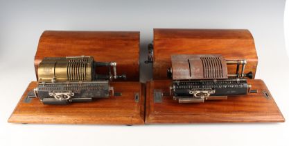 A Muldivo Britannic calculating machine by Guy's of London, with brass cover plate, within a