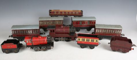 A Hornby gauge O clockwork locomotive 5600 and tender LMS, together with three 1st/3rd coaches, a