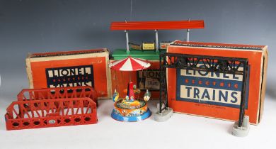 A collection of Lionel gauge O railway accessories, including girder lifting bridge, No. 156