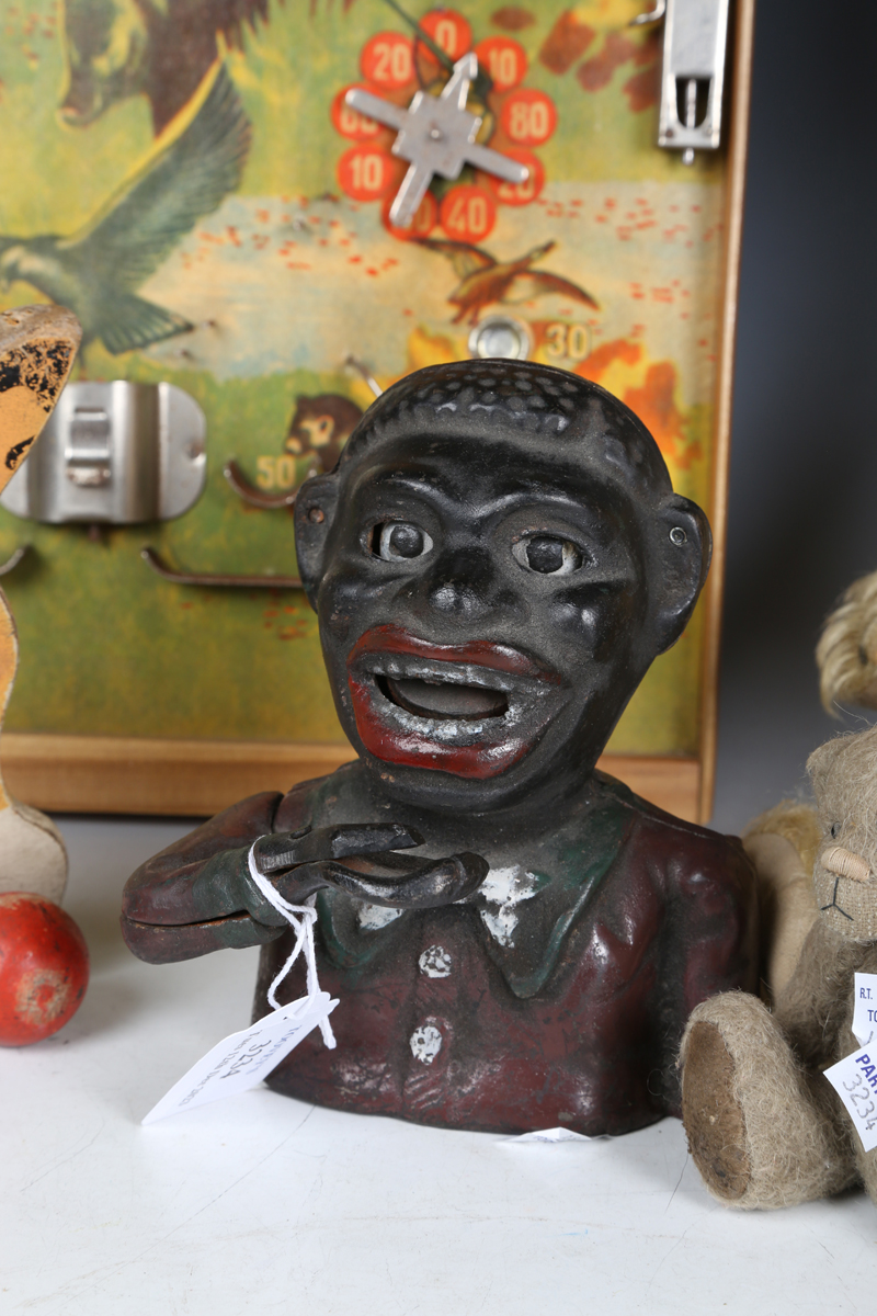 A cast metal money box in the form of a man's head, together with a painted wooden pull-along toy - Image 10 of 10