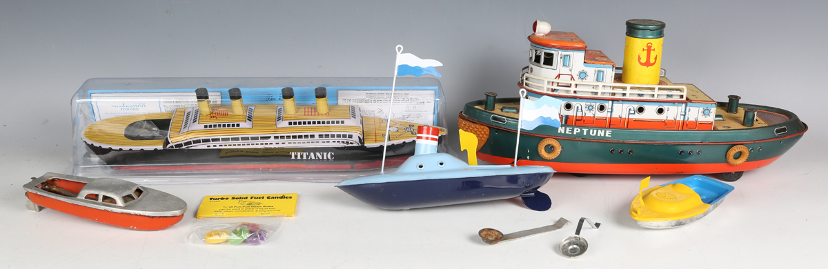 A TM Japan tinplate battery powered tugboat 'Neptune', length 38cm, together with three Camphor-