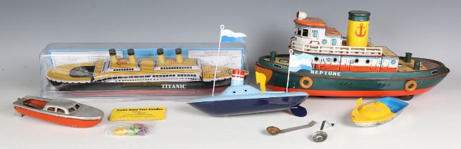 A TM Japan tinplate battery powered tugboat 'Neptune', length 38cm, together with three Camphor-