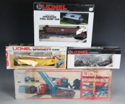 A Lionel O-27 gauge diesel locomotive 600, an operating coal dump car, two other goods wagons, a