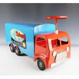 A Tri-ang pressed steel sit-on Long Distance Transport lorry, finished in red and blue, length