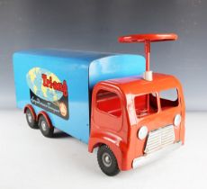 A Tri-ang pressed steel sit-on Long Distance Transport lorry, finished in red and blue, length