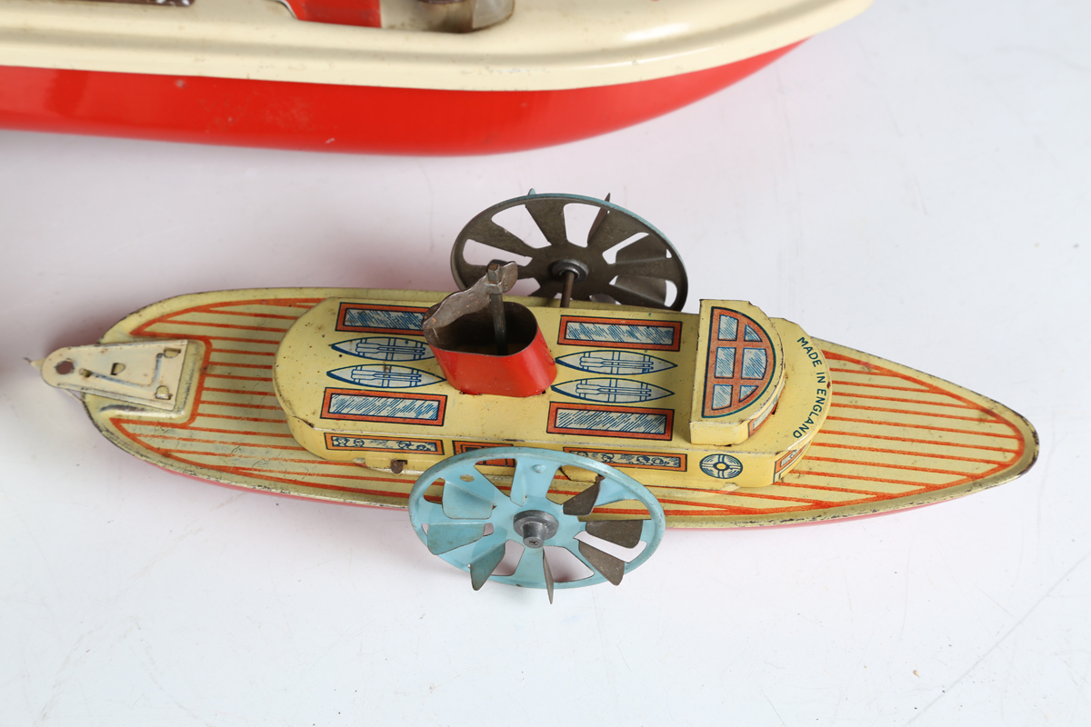 A Wells Brimtoy tinplate clockwork paddle steamer, length 25cm, a German tinplate clockwork liner - Image 3 of 6