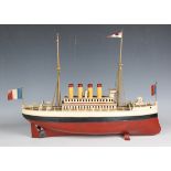 A Carette tinplate clockwork liner with four funnels, two masts with crow's nests and flags, the