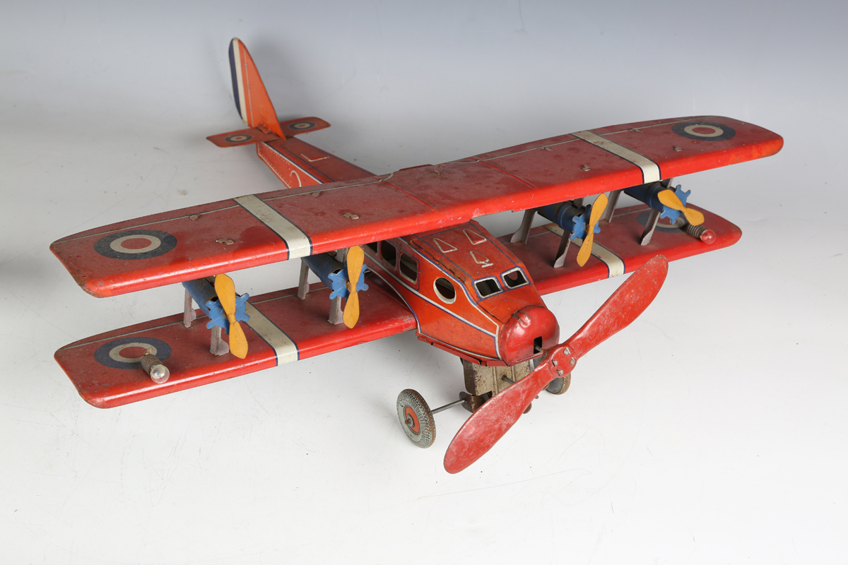 A British tinplate clockwork biplane airliner, possibly Chad Valley, finished in red with Dunlop - Image 5 of 5