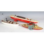 A Wells Brimtoy tinplate clockwork paddle steamer, length 25cm, a German tinplate clockwork liner