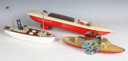 A Wells Brimtoy tinplate clockwork paddle steamer, length 25cm, a German tinplate clockwork liner