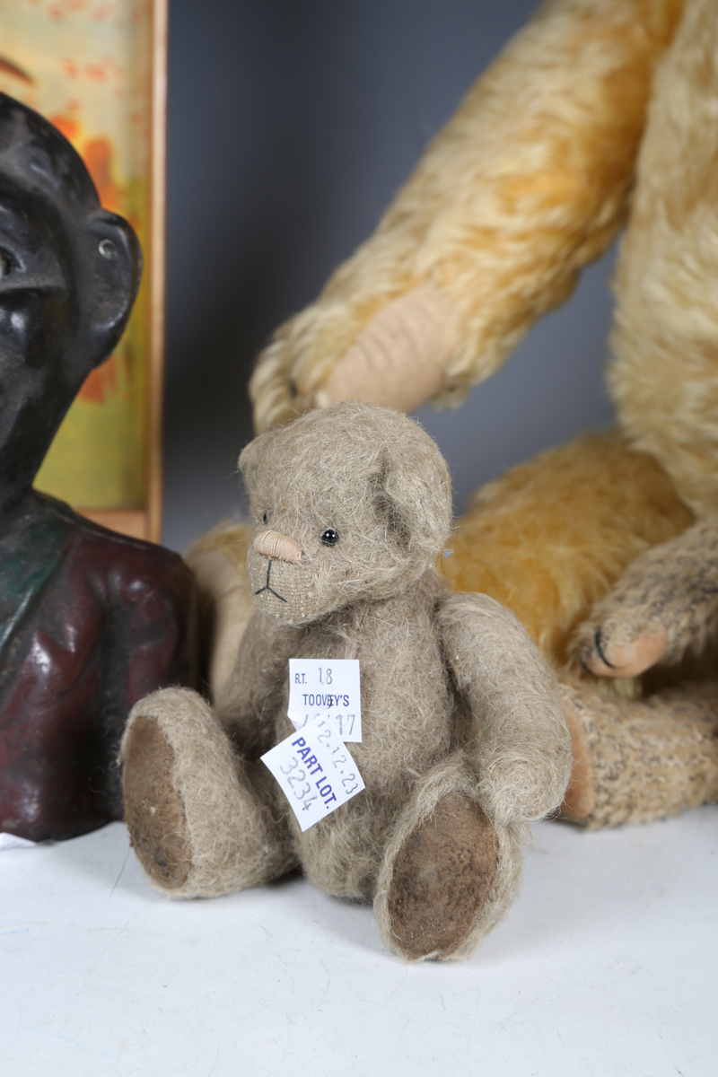 A cast metal money box in the form of a man's head, together with a painted wooden pull-along toy - Image 9 of 10