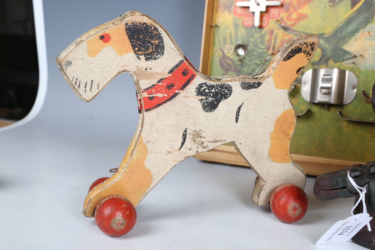 A cast metal money box in the form of a man's head, together with a painted wooden pull-along toy - Image 7 of 10