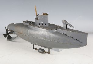 A Duco tinplate clockwork submarine, repainted in grey, with adjustable keel weight, length 38cm.