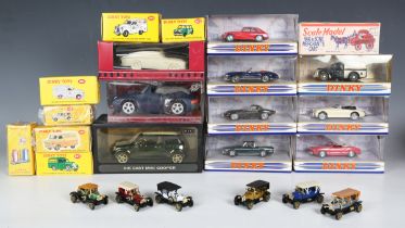 A collection of modern diecast vehicles, including Matchbox Dinky Toys, a brass model of a vintage