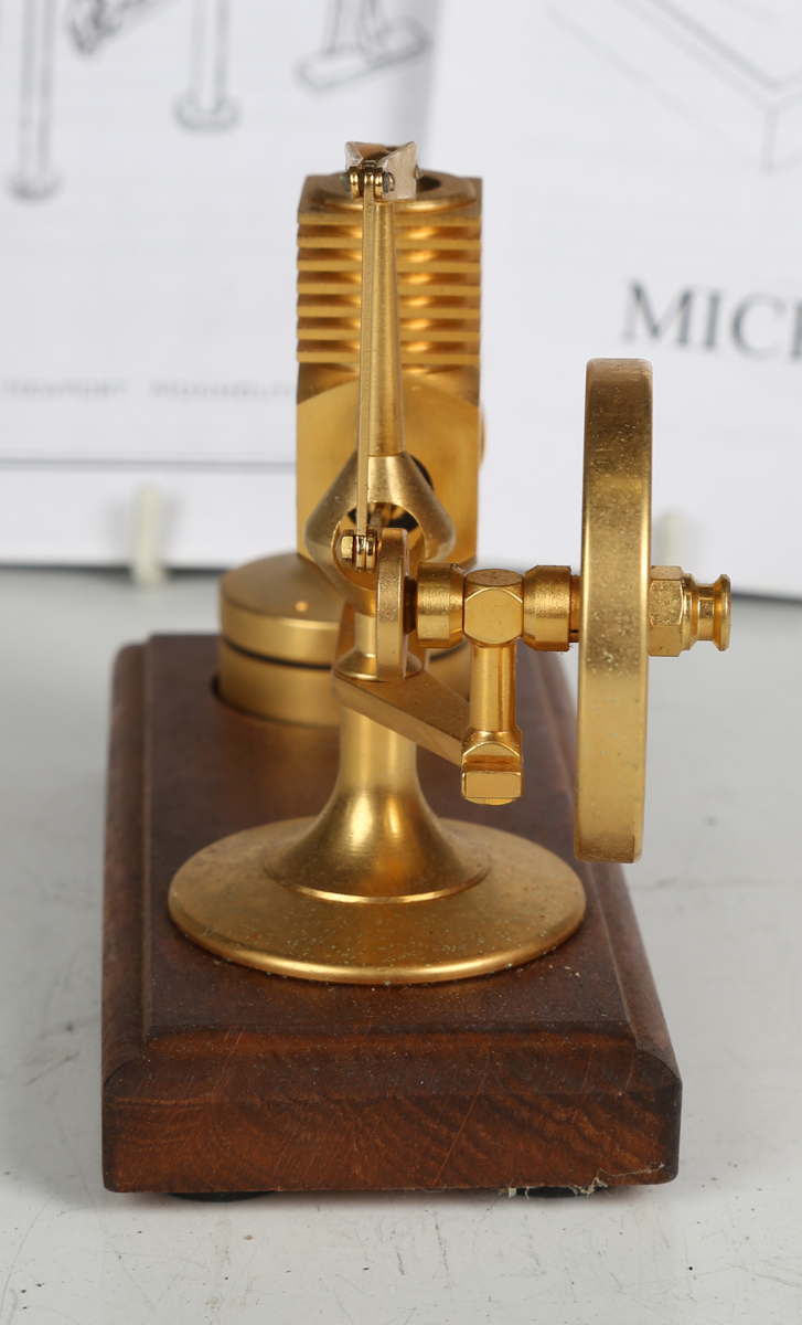 A Micro-Stirling miniature 'Hog Motor' hot air engine with balance beam and glass cylinder, heated - Image 2 of 5