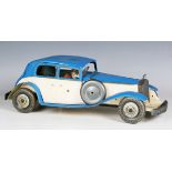 A Mettoy tinplate clockwork Rolls-Royce, finished in blue and cream, with driver, length 38cm (