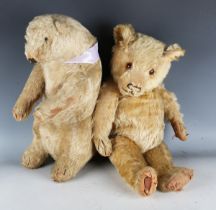 A mid-20th century mohair teddy bear with amber and black eyes, stitched snout and jointed body,