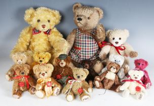 A small collection of Hermann teddy bears, comprising eleven year bears and three others.Buyer’s