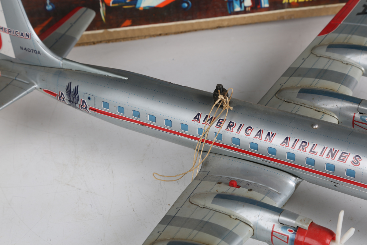 A Yonezawa tinplate battery operated Multi-Act DC-7C plane 'American Airlines' with moving - Image 6 of 8