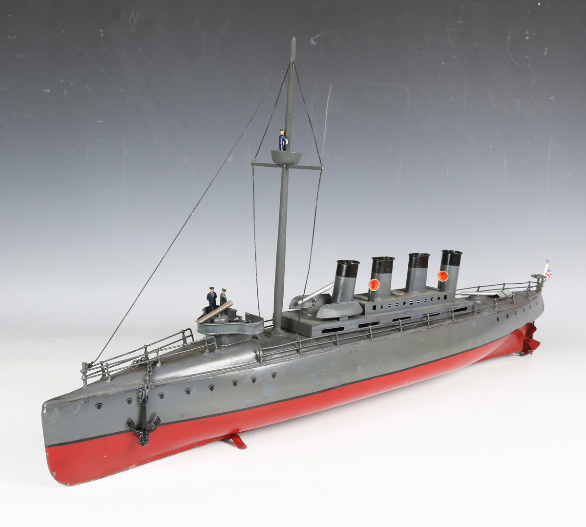 A Bing tinplate clockwork model of a torpedo ship, fitted with a mast with crow's nest and four