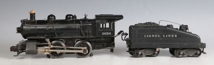 A Lionel gauge O three-rail locomotive 1565 and tender, a group of locomotive parts, four items of