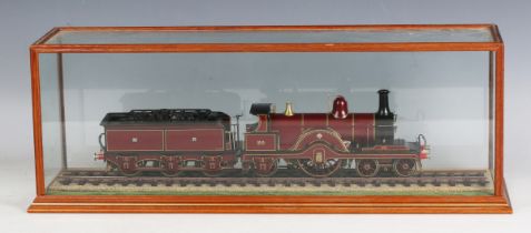 A Finescale gauge O model of a Class 115 4-2-2 locomotive 20 and six-wheel tender in Midland Railway