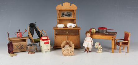 A German all-bisque doll's house doll, height 9cm, four other all-bisque doll's house dolls and a