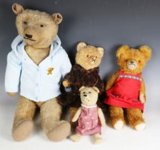 A mid-20th century mohair teddy bear with boot button eyes, stitched snout and jointed body,