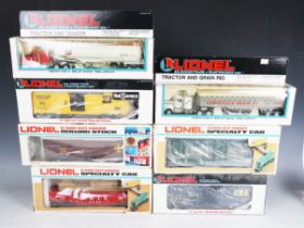 A collection of Lionel gauge O railway items, including operating coal dump car, automatic