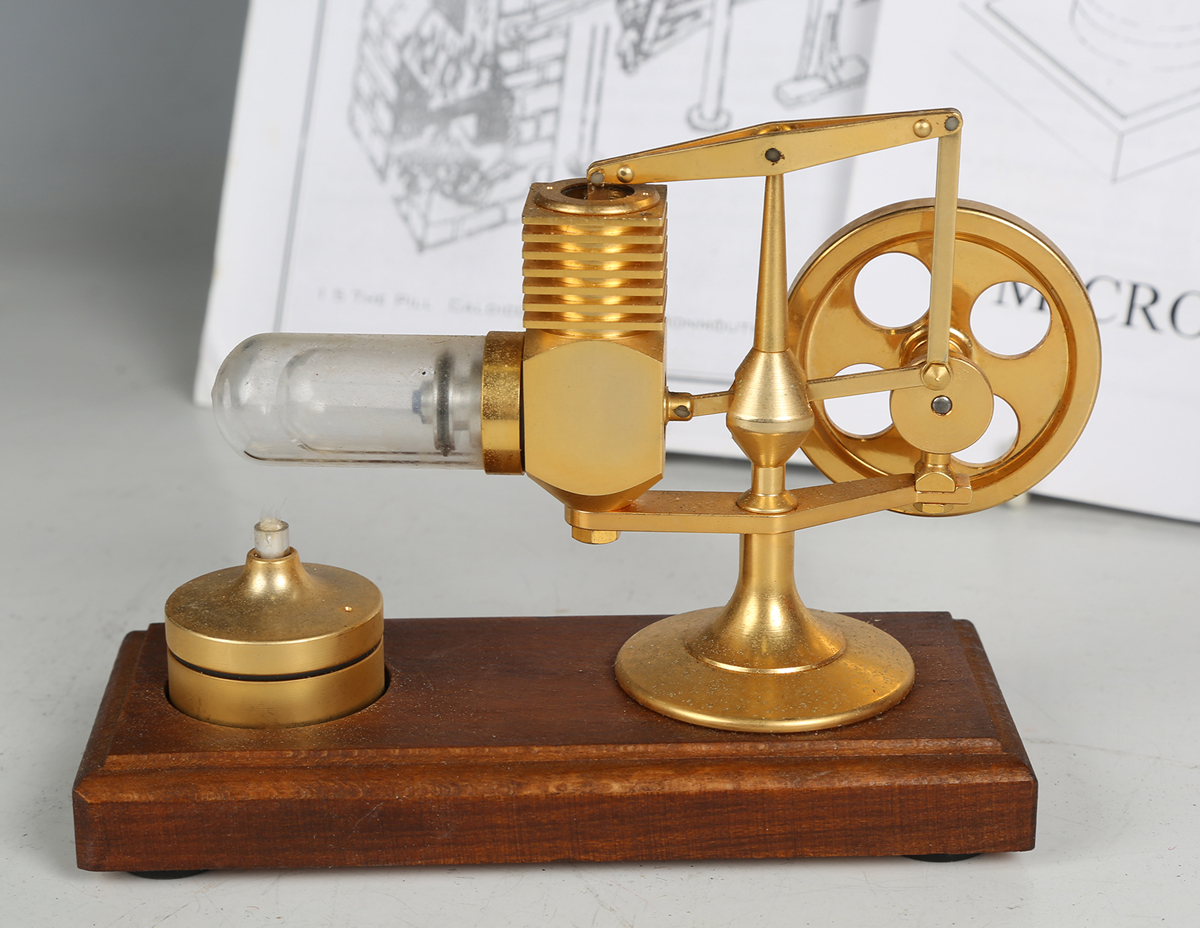 A Micro-Stirling miniature 'Hog Motor' hot air engine with balance beam and glass cylinder, heated - Image 3 of 5