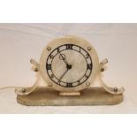 An Art Deco mantel clock with painted metal dial in alabaster and acrylic mounts