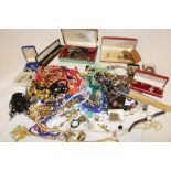 A selection of various costume jewellery including ear rings, necklaces, brooches,