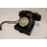 A 1950's/60's black telephone with chromium plated mounts