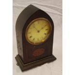 An Edwardian mantel clock with circular dial in inlaid mahogany Gothic arched case