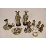 A pair of silver plated spill vases with engraved decoration, silver plated cruet items,