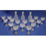 A suite of good quality cut glass comprising 3 cut glass barrel-shaped decanters and stoppers and