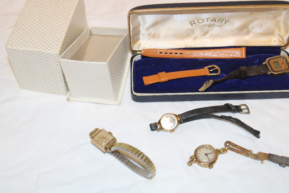 A ladies 9ct gold wristwatch by Baume with elasticated strap,