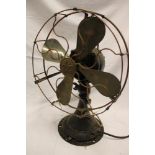 An old copper and painted metal desk fan by GEC