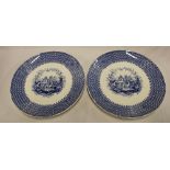 A pair of Mintons pottery circular platters with blue and white cathedral decoration 15" diameter