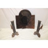 An old cast-iron arched fire back with raised coat of arms decoration 22" x 21" together with a